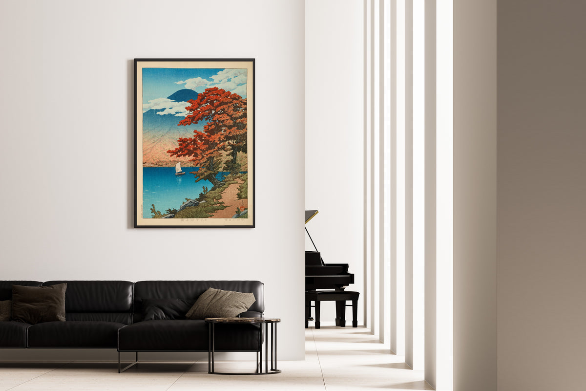 Framed art print of Lake Chuzenji at Nikko by Kawase Hasui, on the wall of a minimal living room