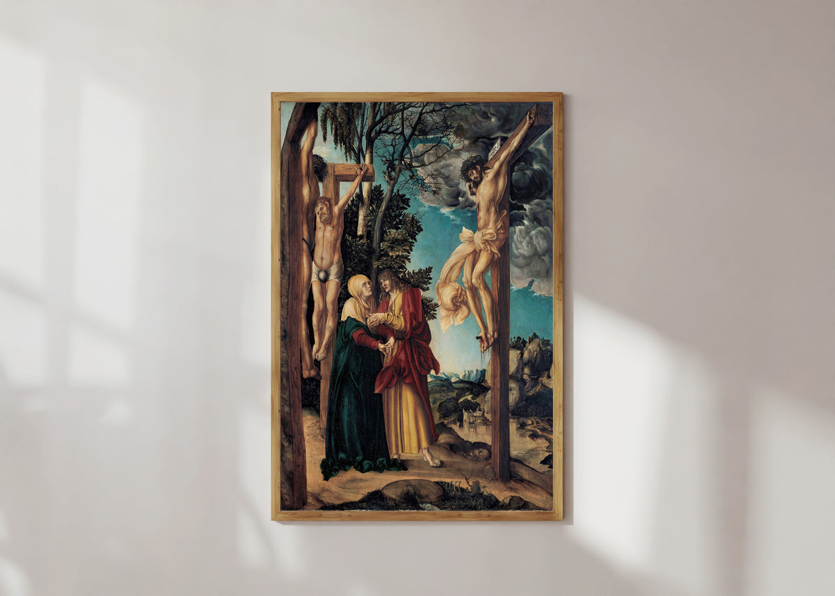 Framed art print of Lamentation under the Cross by Lucas Cranach the Elder, in a light wood frame on a sunlit white wall