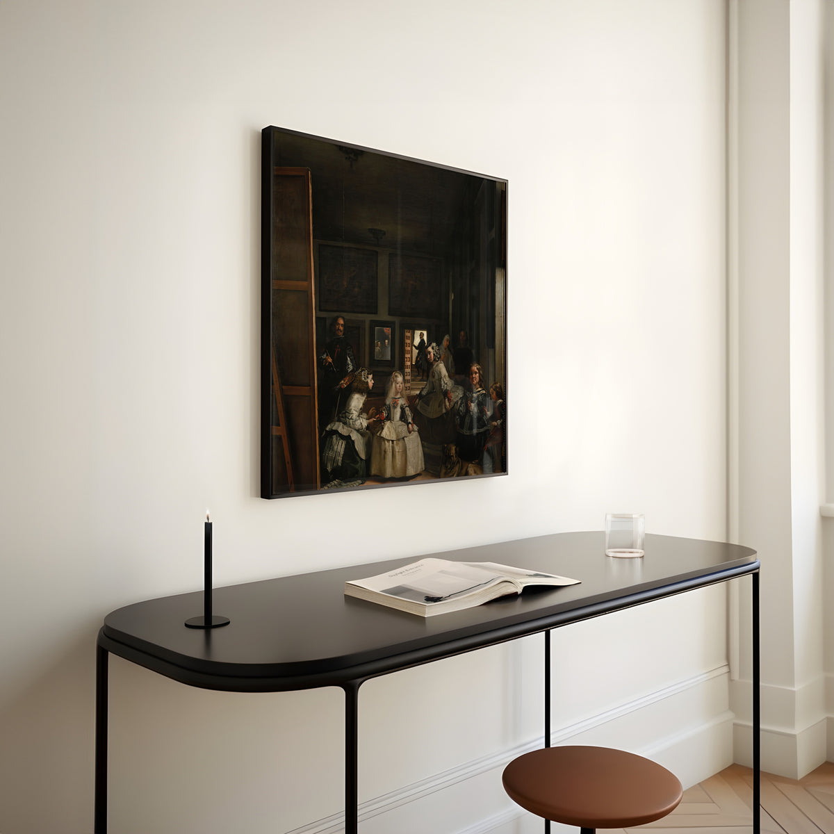 Framed art print of Las Meninas by Diego Velázquez, above a slim black console table
