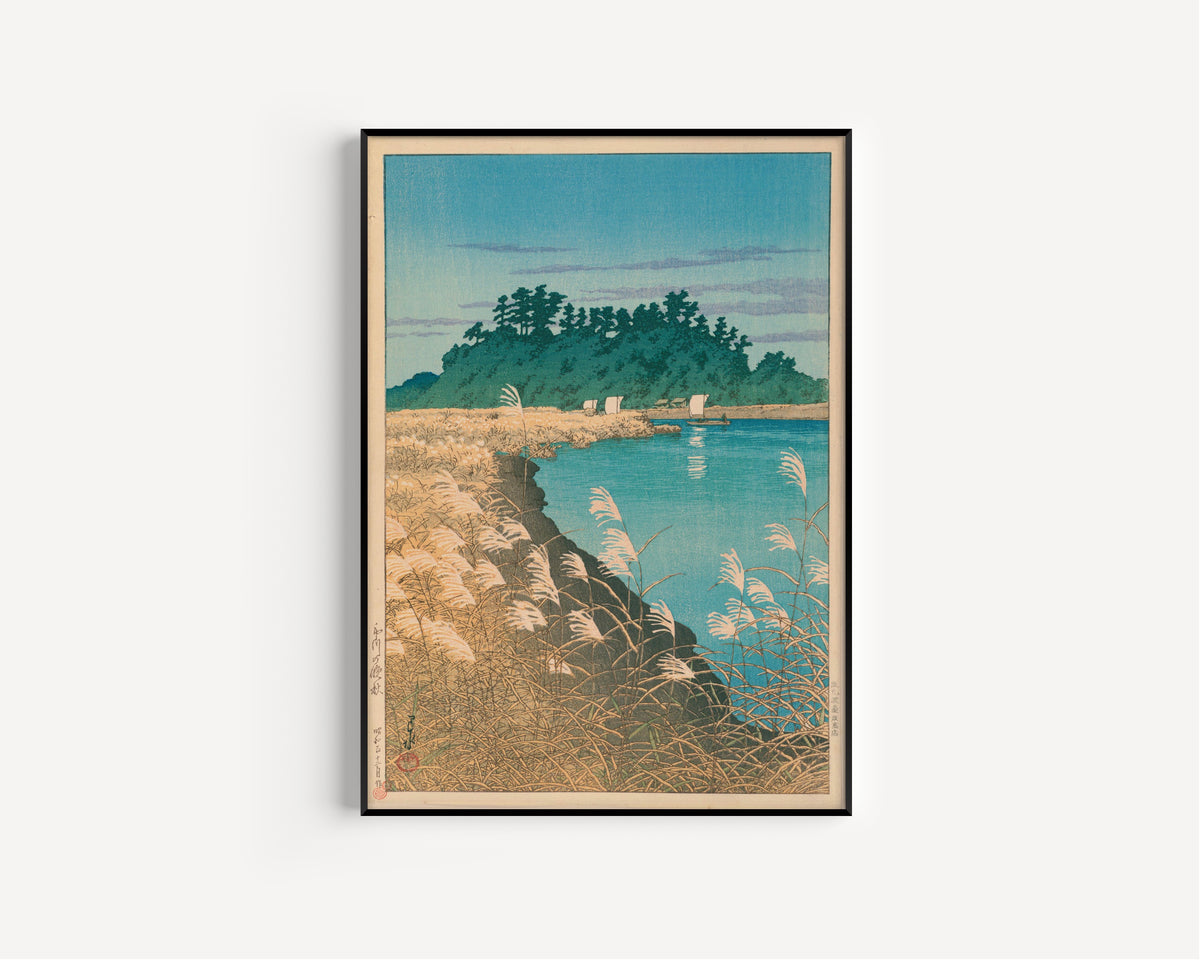 Framed art print of Late Autumn in Ichikawa by Kawase Hasui, in a slim black frame on a plain white wall