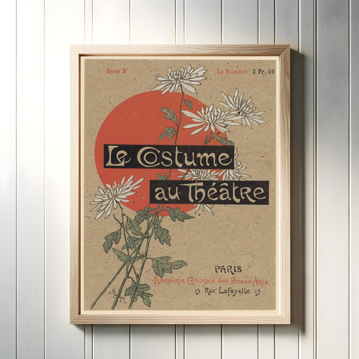 Framed art print of Le Costume au Théâtre by Théophile Steinlen, in a light wood frame on a white panelled wall