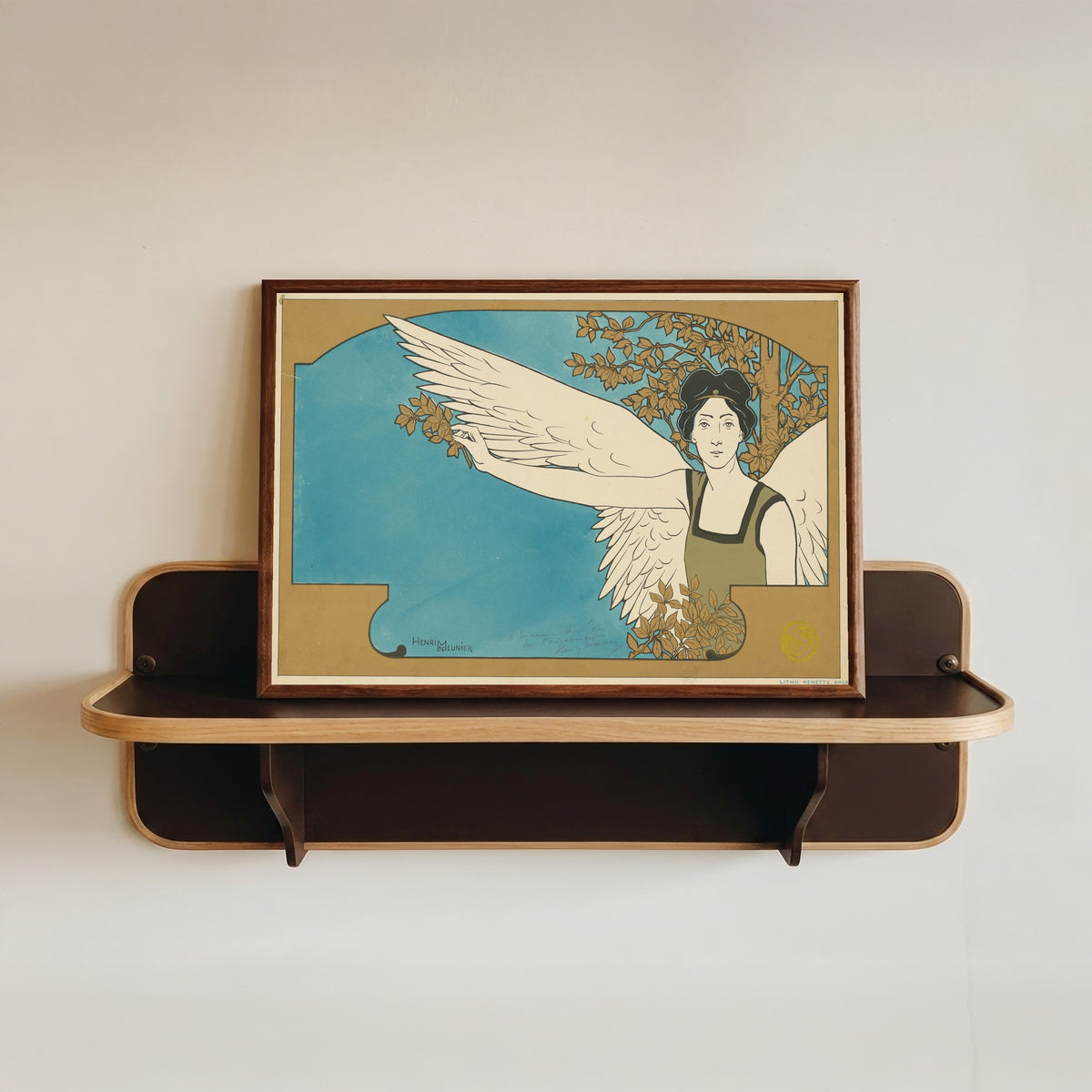 Framed art print of Le Guide Musical: Revue de la Musique et des Théâtres by Henri Meunier, in a dark wood frame resting on a wall shelf