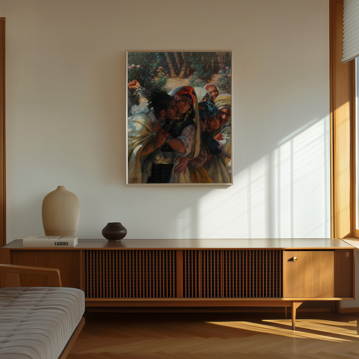 Framed art print of Le Printemps des coeurs by Étienne Dinet, in a thin light frame on a sunlit wall above a wooden sideboard