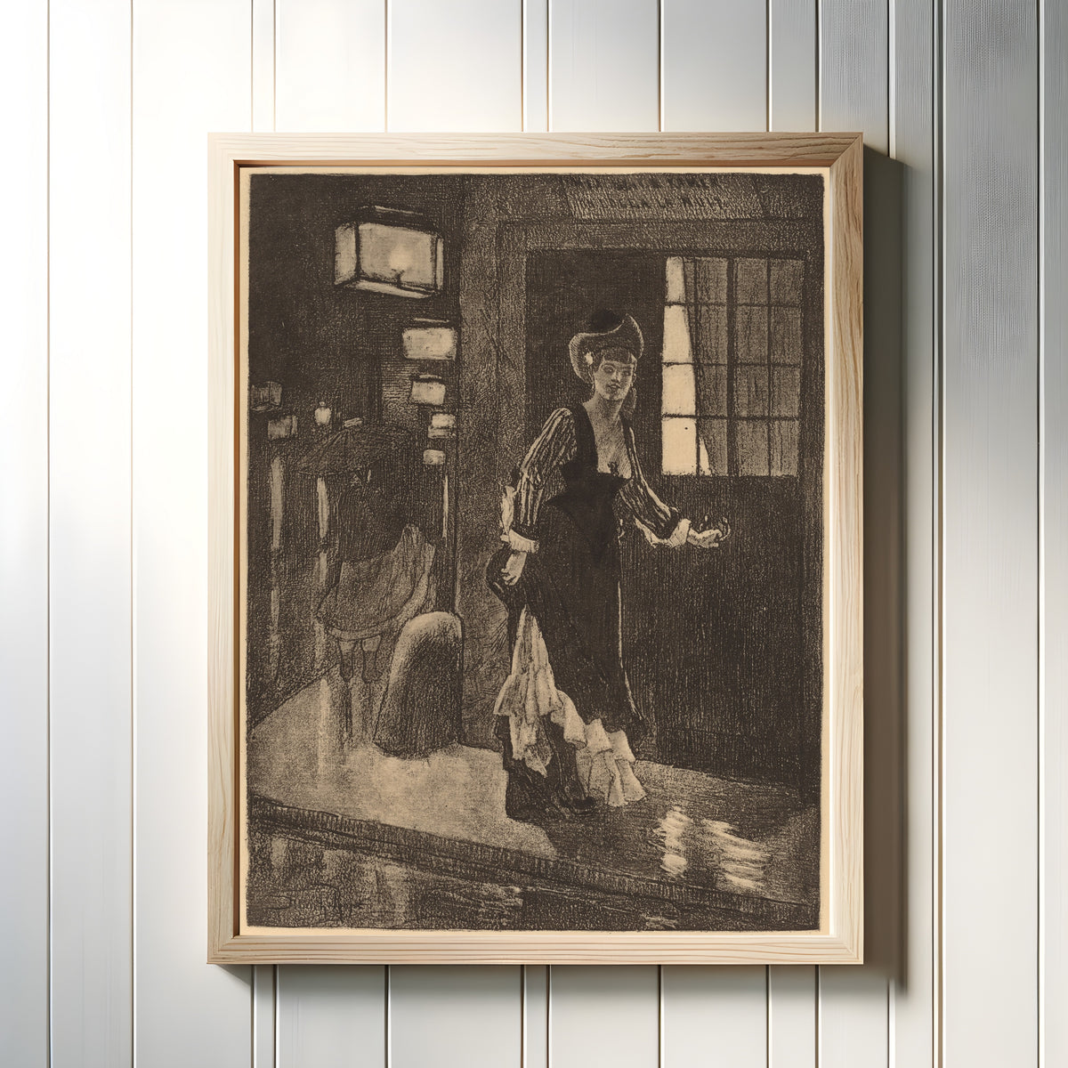 Framed art print of Le Rydeack by Félicien Rops, in a light wood frame on a white panelled wall