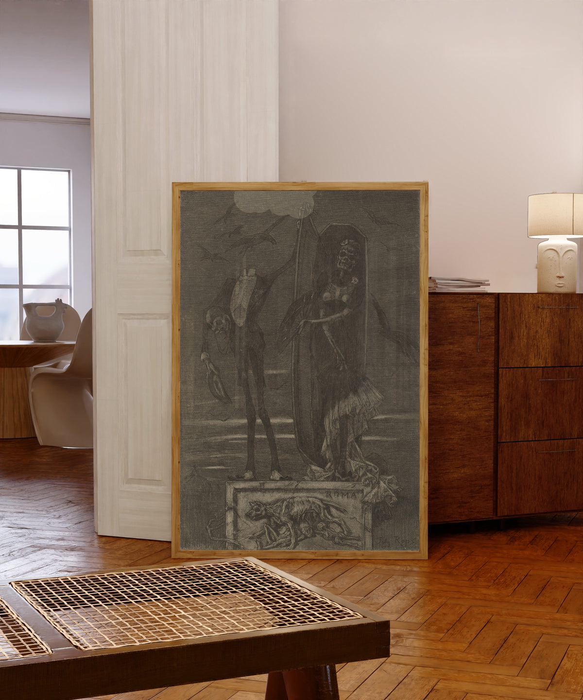 Framed art print of Le Vice suprême: Frontispiece by Félicien Rops, in a light wood frame leaning in a warm room with a parquet floor