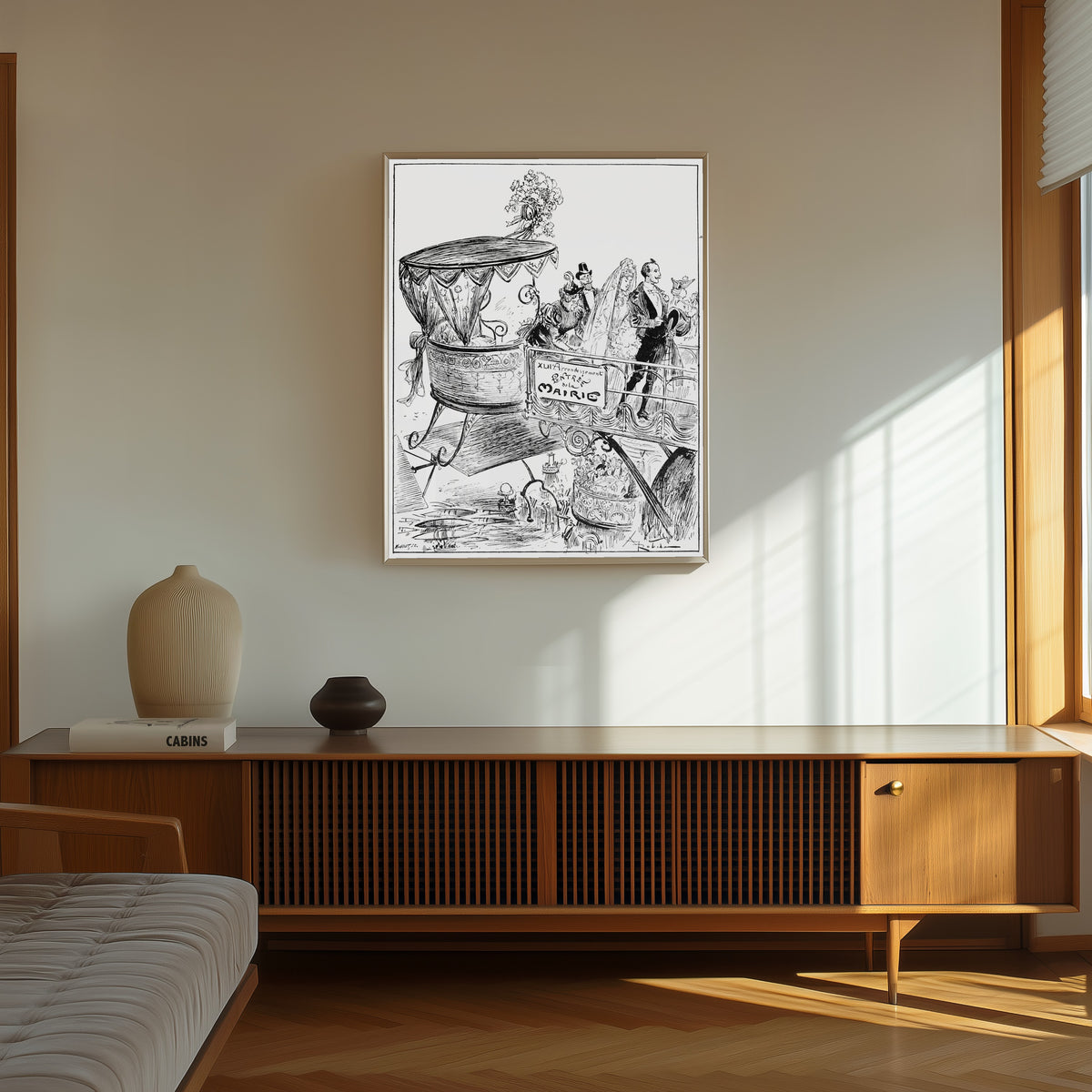 Framed art print of Arrivée à la mairie by Albert Robida, in a thin light frame on a sunlit wall above a wooden sideboard
