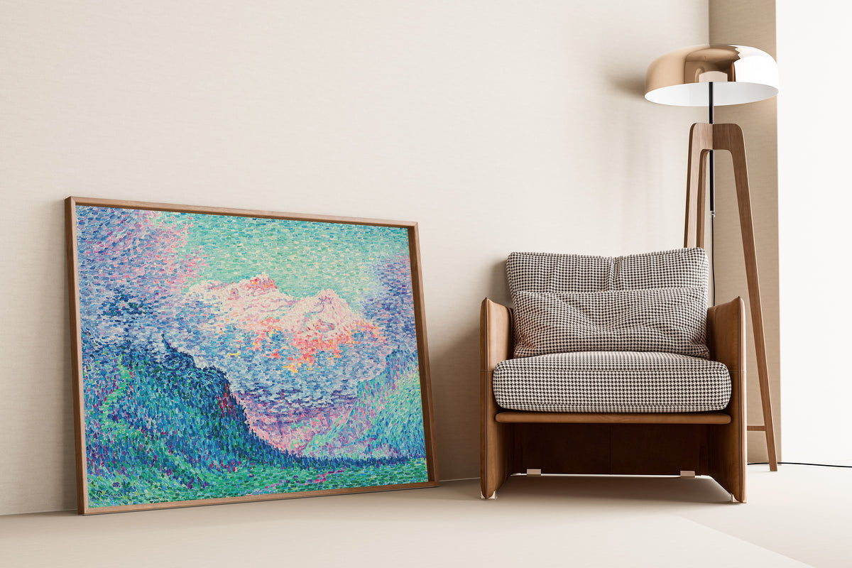Framed art print of Les Diablerets (The Oldenhorn and the Bécabesson) by Paul Signac, leaning against a wall beside an armchair and a floor lamp