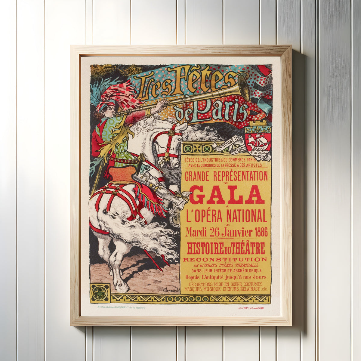Framed art print of Les Fêtes de Paris, Grande Représentation de Gala à l'Opéra National, le… by Eugène Grasset, in a light wood frame on a white panelled wall