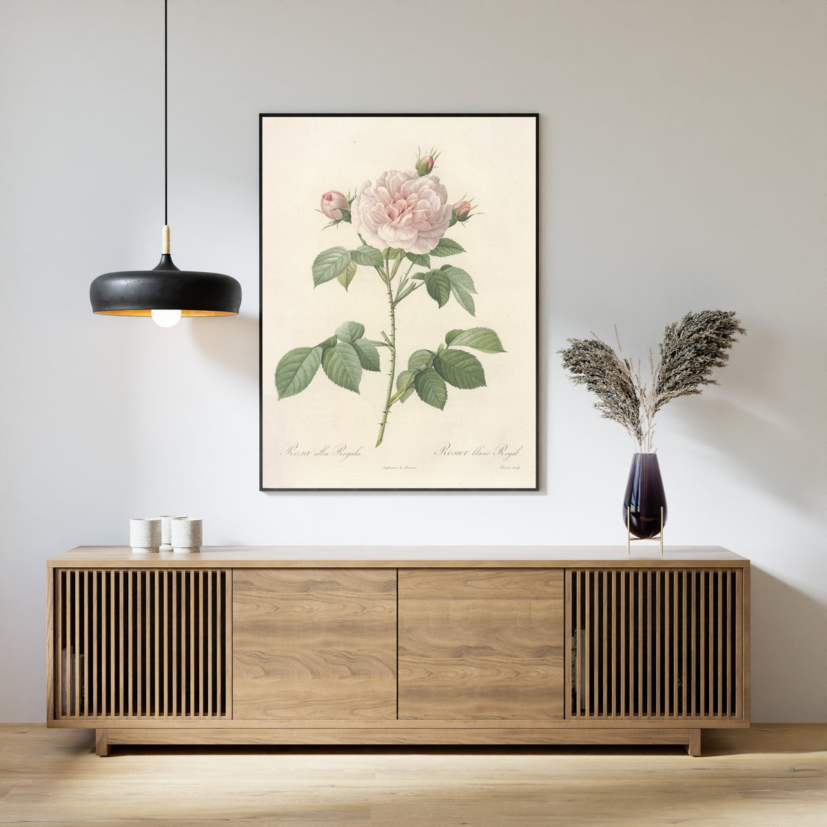 Framed art print of Les Roses: Rosa Alba Regalis by Pierre-Joseph Redouté, above a slatted wood sideboard