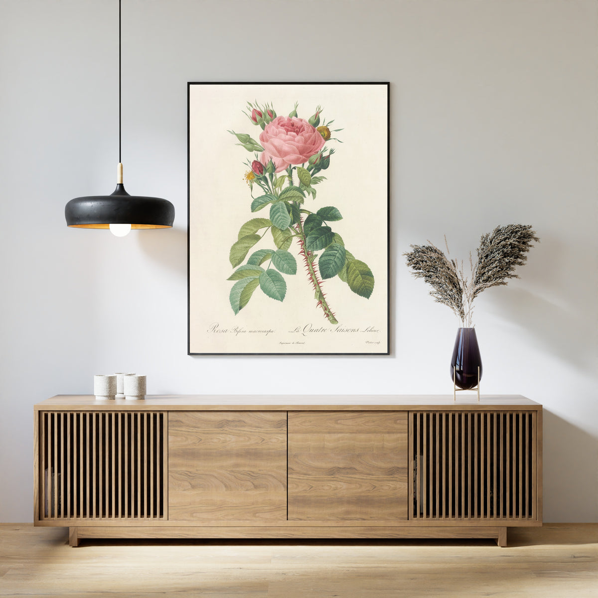 Framed art print of Les Roses: Rosa Bifera Macrocarpa by Pierre-Joseph Redouté, above a slatted wood sideboard
