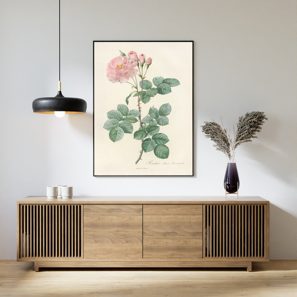 Framed art print of Les Roses: Rosa Damascena Aurora by Pierre-Joseph Redouté, above a slatted wood sideboard