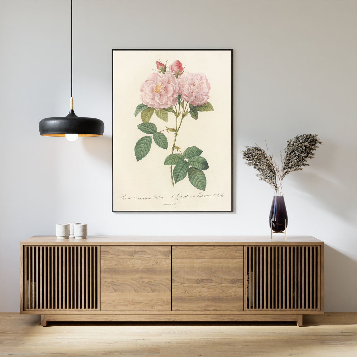 Framed art print of Les Roses: Rosa Damascena Italica by Pierre-Joseph Redouté, above a slatted wood sideboard