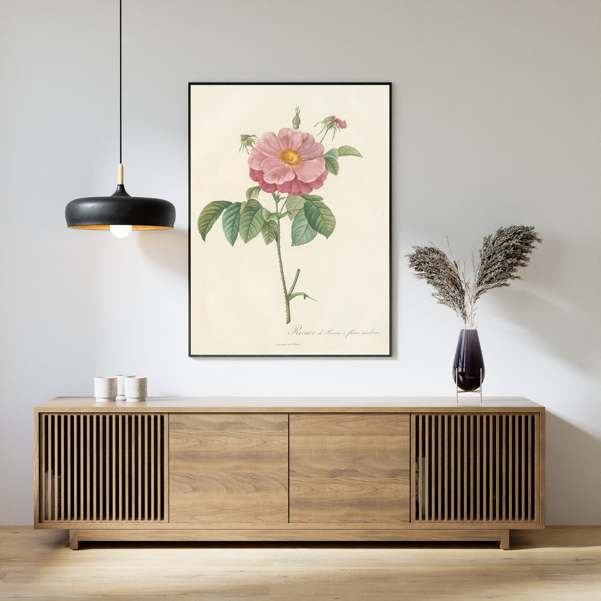 Framed art print of Les Roses: Rosa Gallica Flore Marmoreo by Pierre-Joseph Redouté, above a slatted wood sideboard