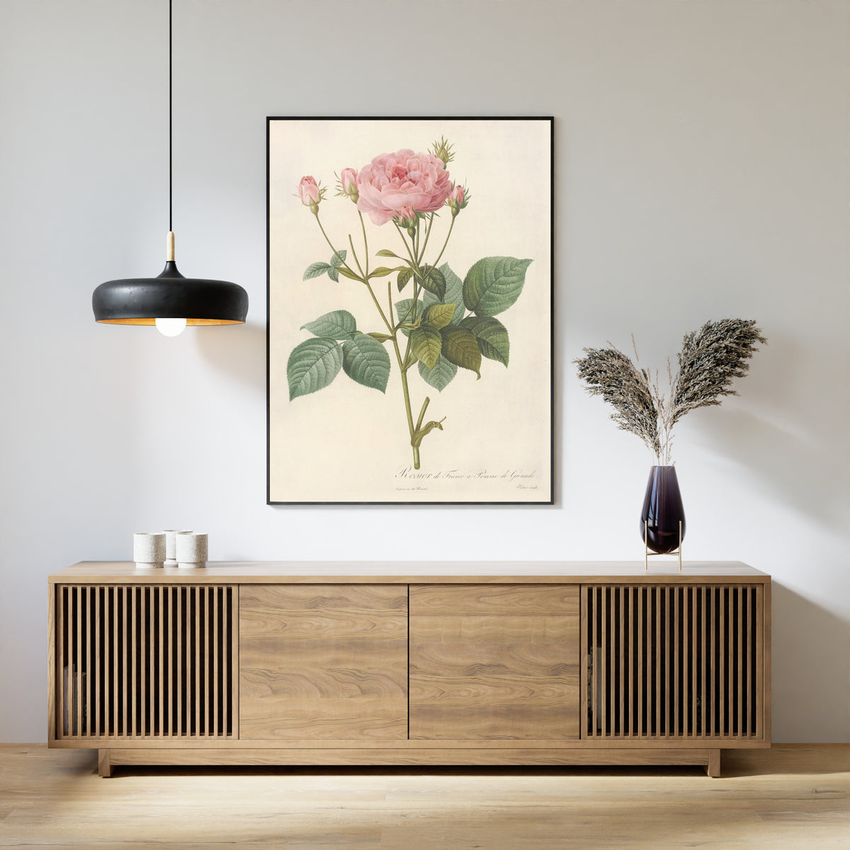 Framed art print of Les Roses: Rosa Gallica Granatus by Pierre-Joseph Redouté, above a slatted wood sideboard