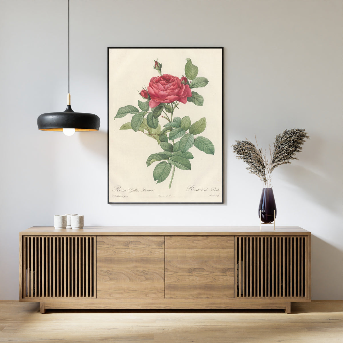 Framed art print of Les Roses: Rosa Gallica Pontiana by Pierre-Joseph Redouté, above a slatted wood sideboard