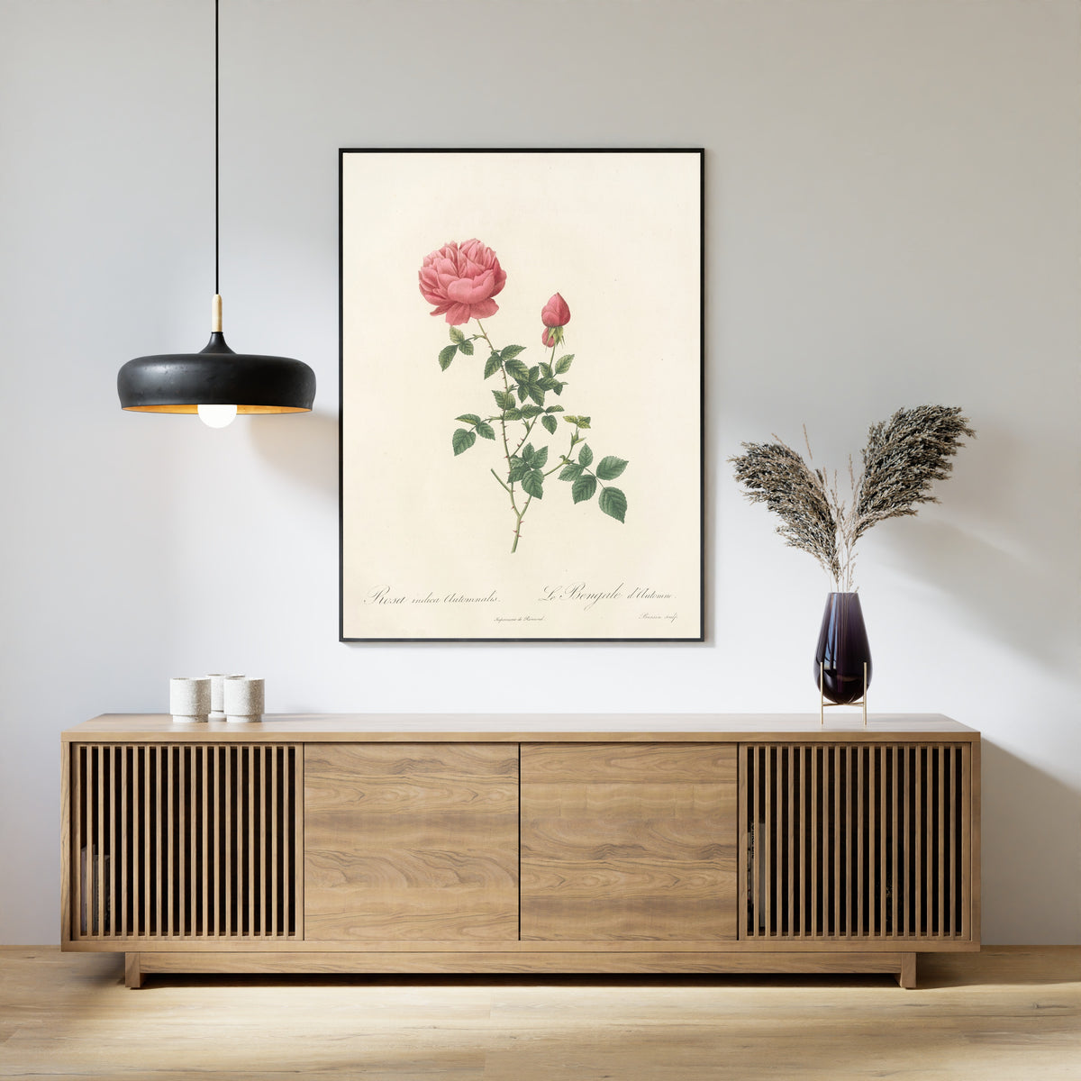 Framed art print of Les Roses: Rosa Indica Automnalis by Pierre-Joseph Redouté, above a slatted wood sideboard