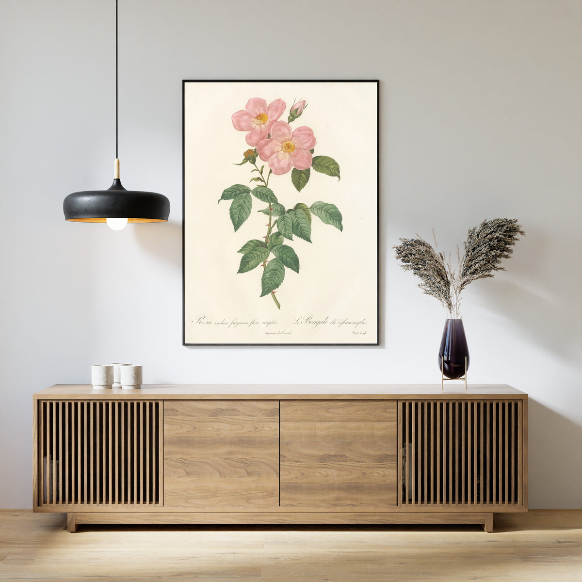 Framed art print of Les Roses: Rosa Indica Fragrans Flore Simplici by Pierre-Joseph Redouté, above a slatted wood sideboard