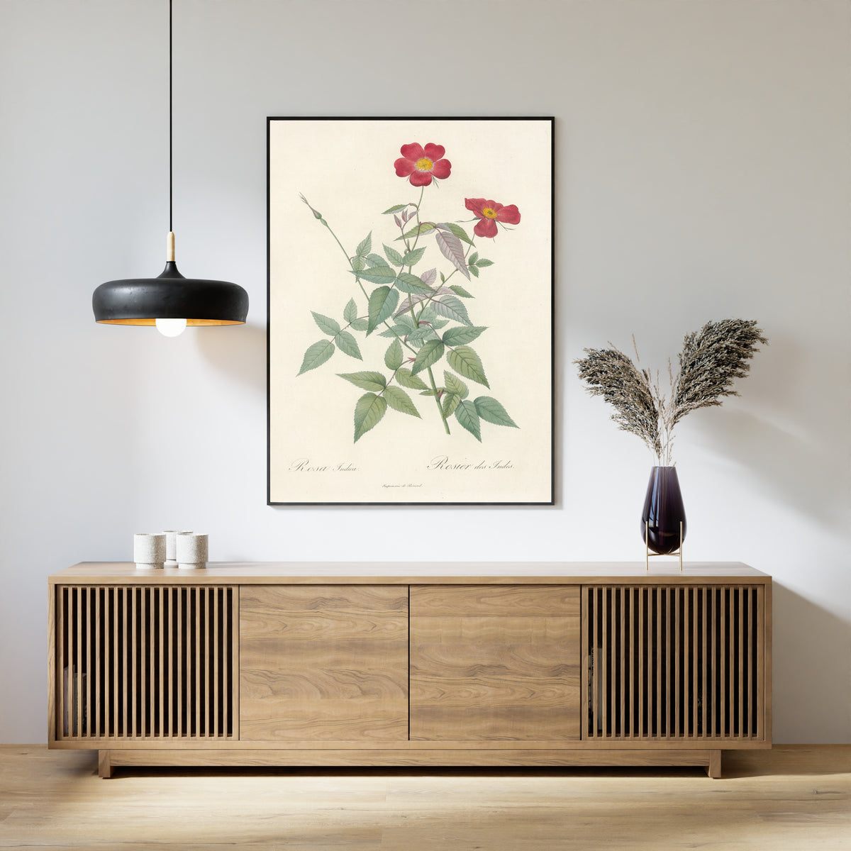 Framed art print of Les Roses: Rosa Indica (Rosier des Indes) by Pierre-Joseph Redouté, above a slatted wood sideboard