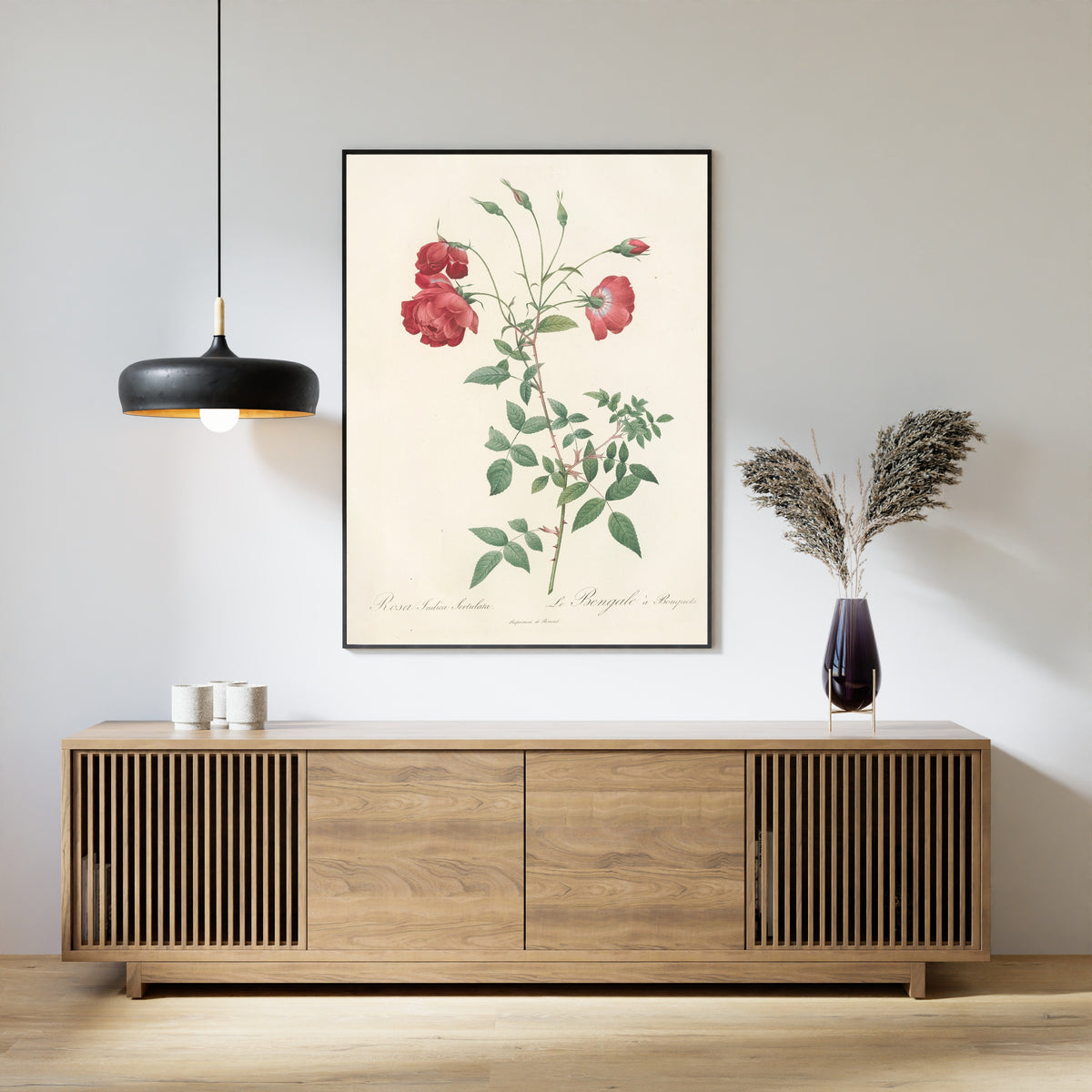 Framed art print of Les Roses: Rosa Indica Sertulata by Pierre-Joseph Redouté, above a slatted wood sideboard