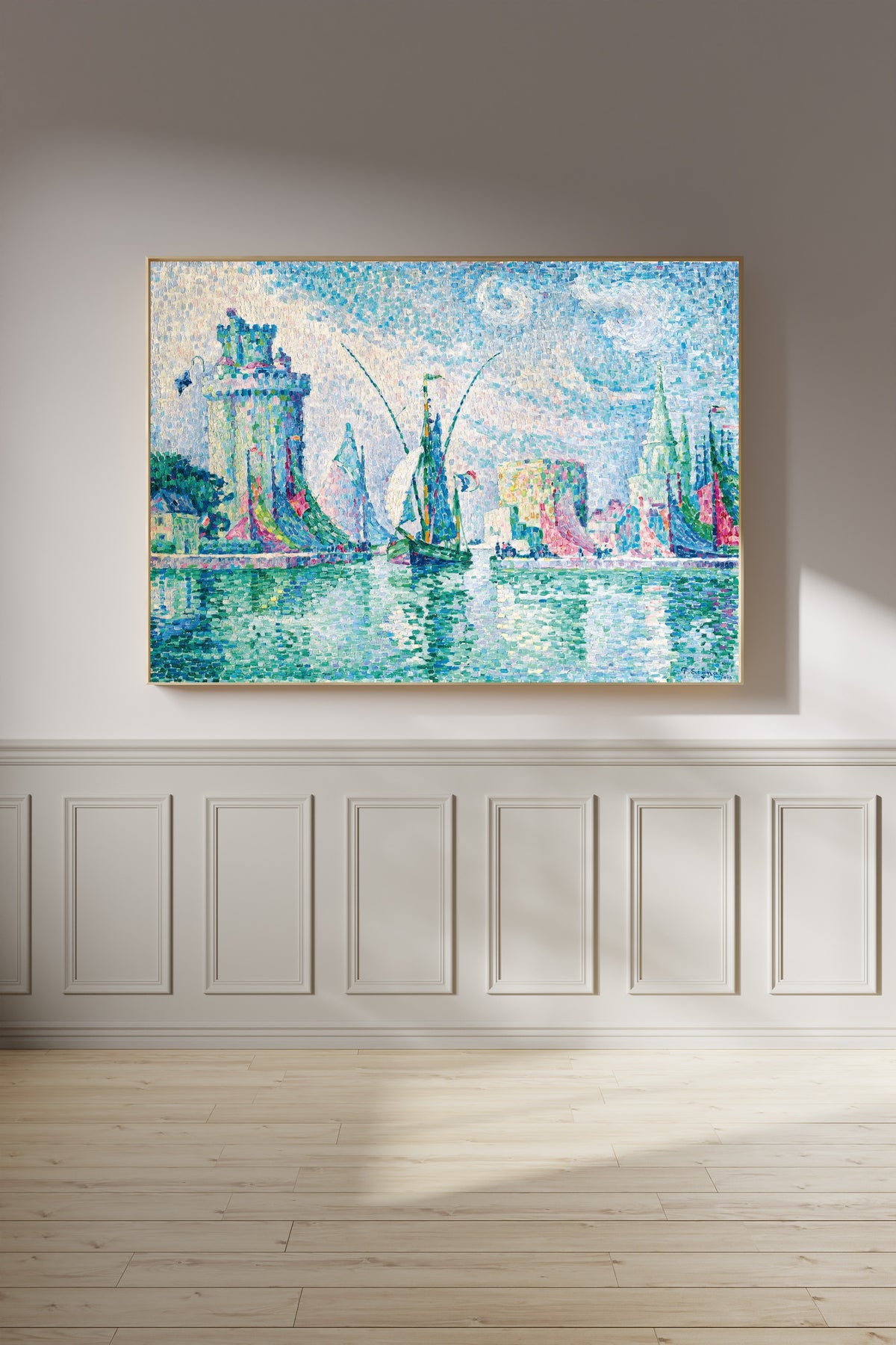 Framed art print of Les Tours Vertes, La Rochelle by Paul Signac, on a panelled wall in afternoon light