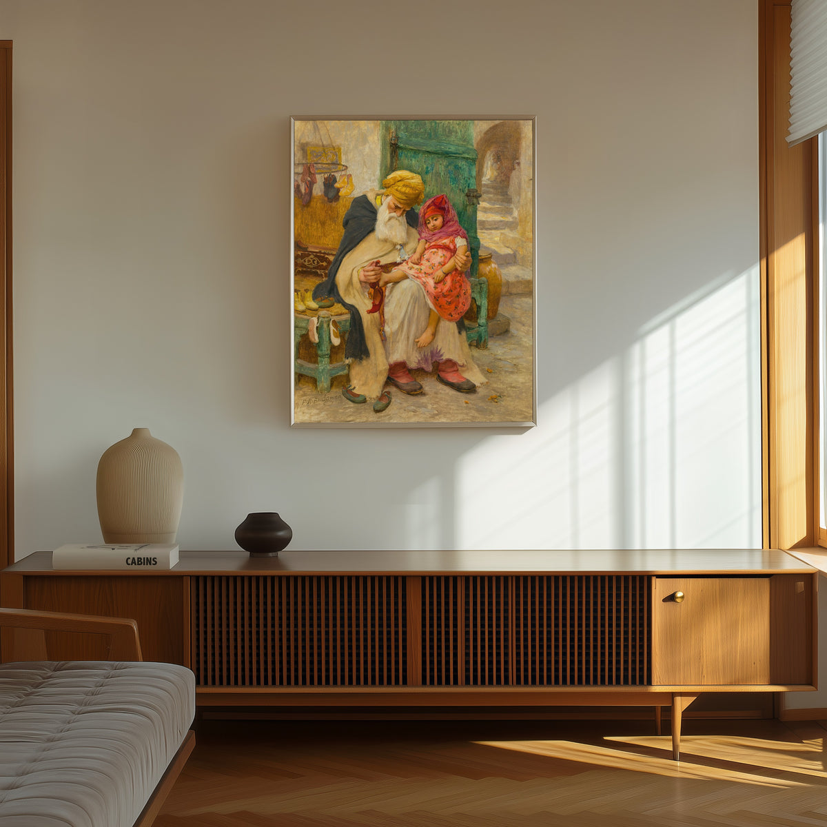 Framed art print of Les babouches by Frederick Arthur Bridgman, in a thin light frame on a sunlit wall above a wooden sideboard
