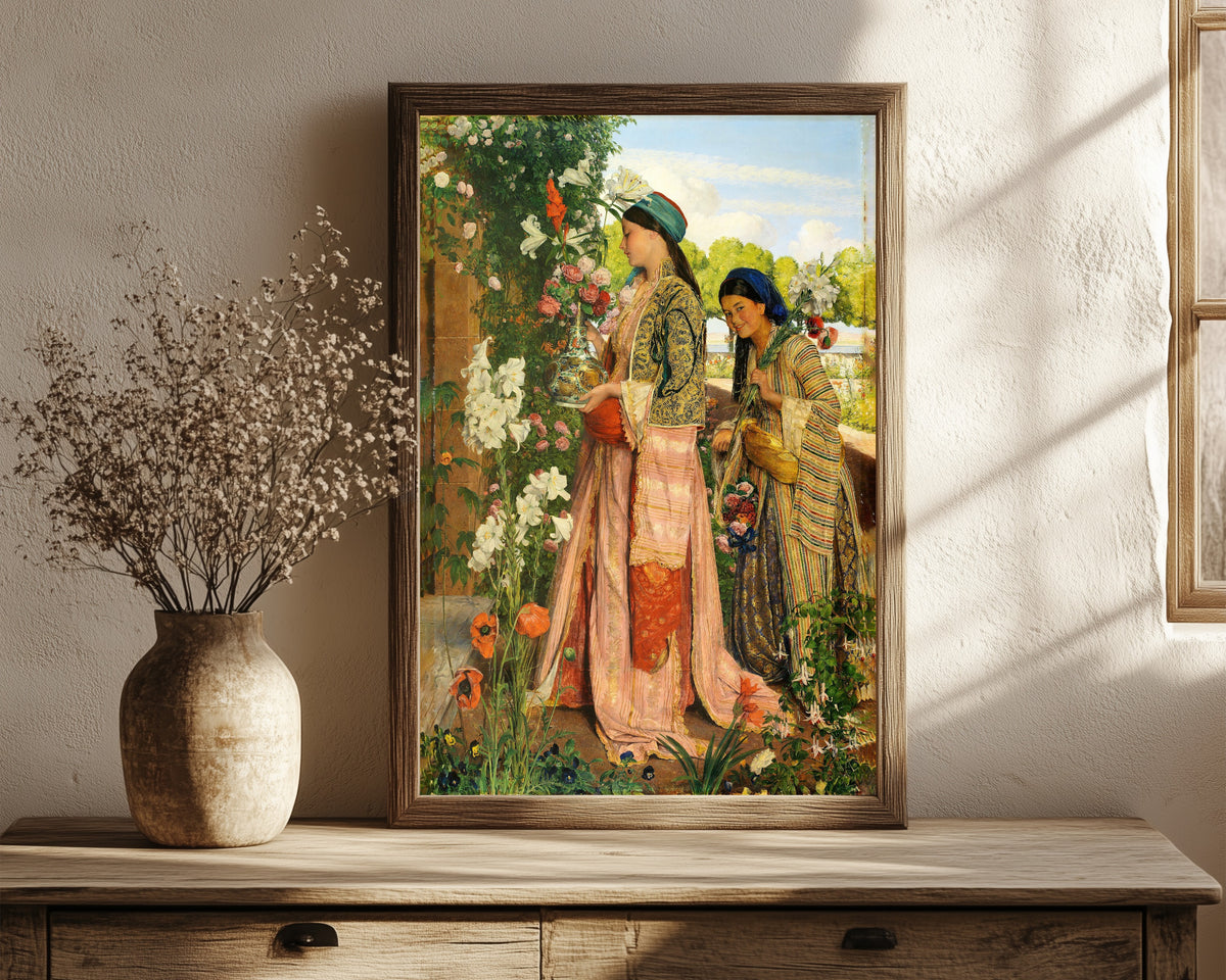 Framed art print of Lilium Auratum by John Frederick Lewis, in a dark wood frame leaning on a rustic console beside dried flowers