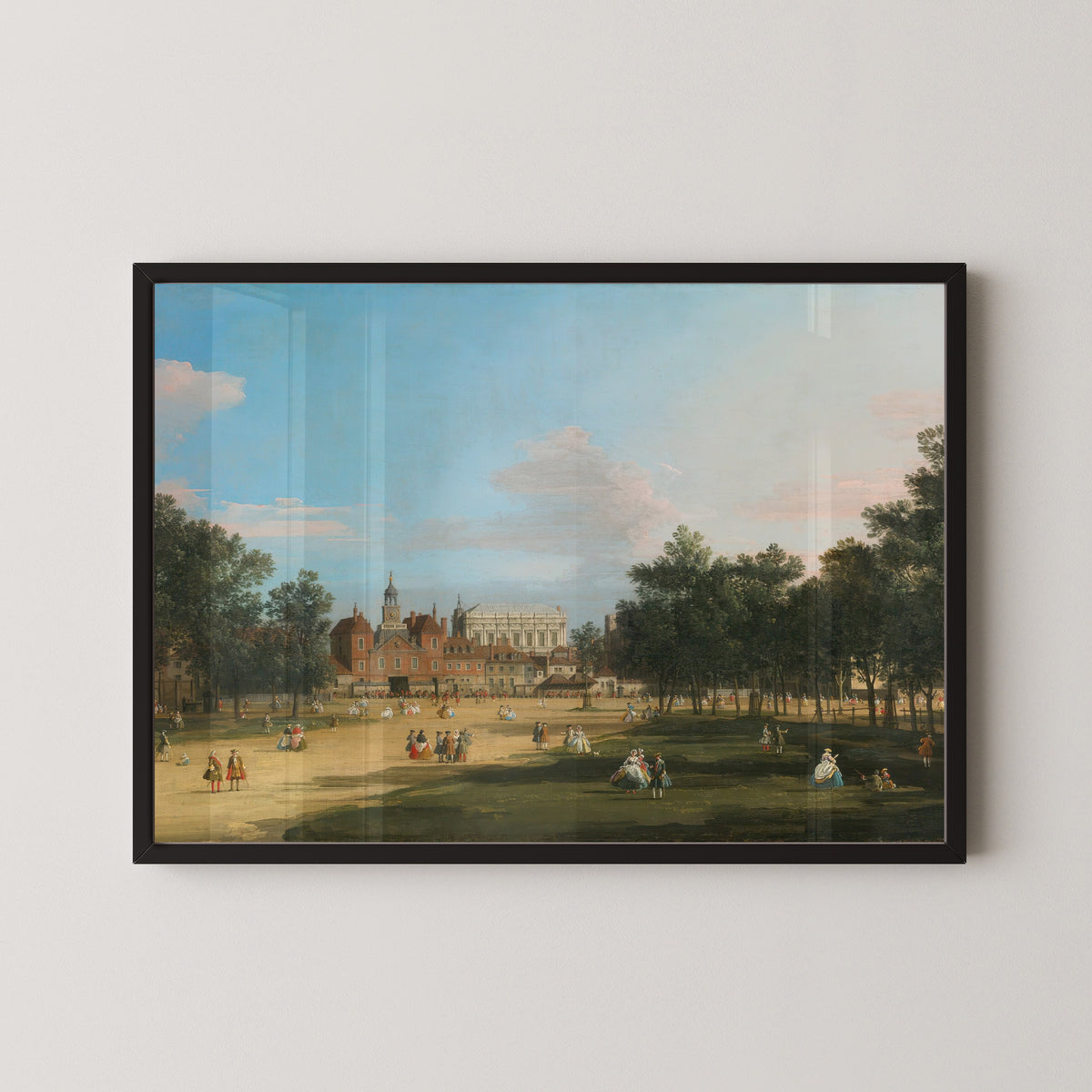 Framed art print of London, A View of the Old Horse Guards and Banqueting Hall, Whitehall Seen from St. James’… by Canaletto, in a black frame on a pale wall
