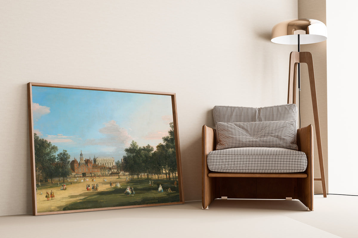 Framed art print of London, A View of the Old Horse Guards and Banqueting Hall… by Canaletto, leaning against a wall beside an armchair and a floor lamp