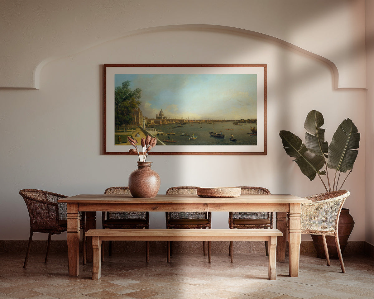 Framed art print of London – The Thames from Somerset House Terrace towards the City by Canaletto, above a wooden dining table