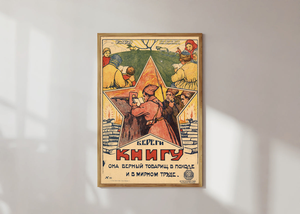 Framed art print of Look after the book: it is a faithful comrade on the march and in peaceful labour, in a light wood frame on a sunlit white wall