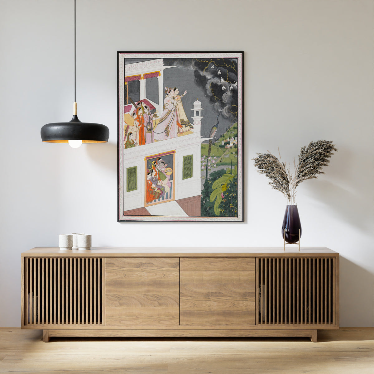 Framed art print of Lovers Watching an Approaching Thunderstorm by Kangra school, above a slatted wood sideboard