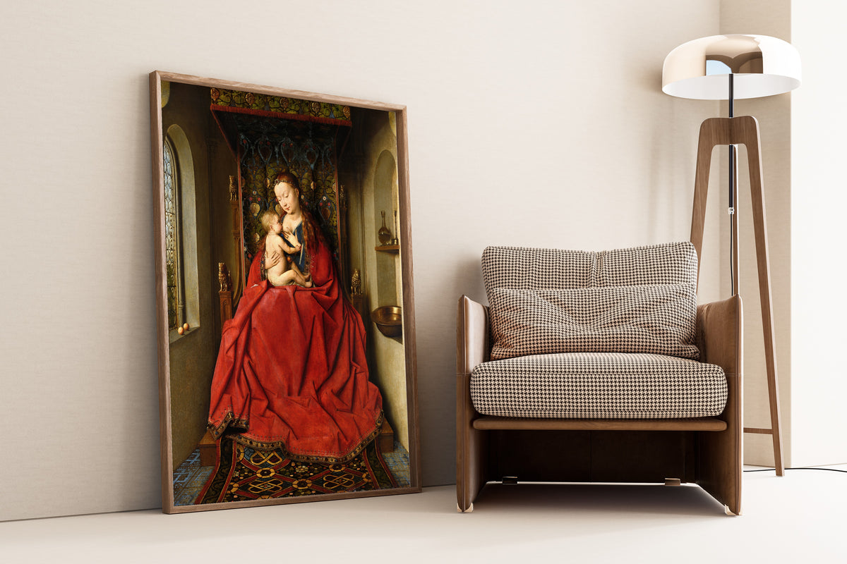 Framed art print of Lucca Madonna by Jan van Eyck, leaning against a wall beside an armchair and a floor lamp