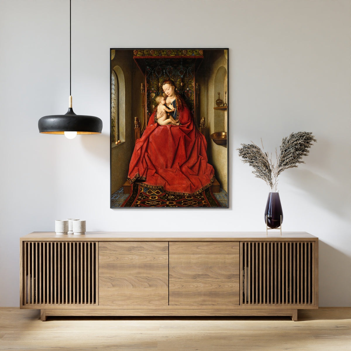 Framed art print of Lucca Madonna by Jan van Eyck, above a slatted wood sideboard