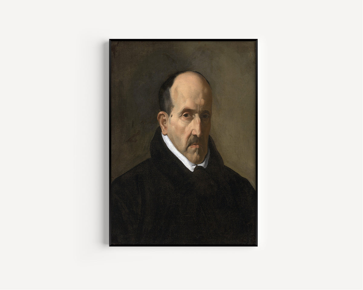 Framed art print of Luis de Góngora y Argote by Diego Velázquez, in a slim black frame on a plain white wall