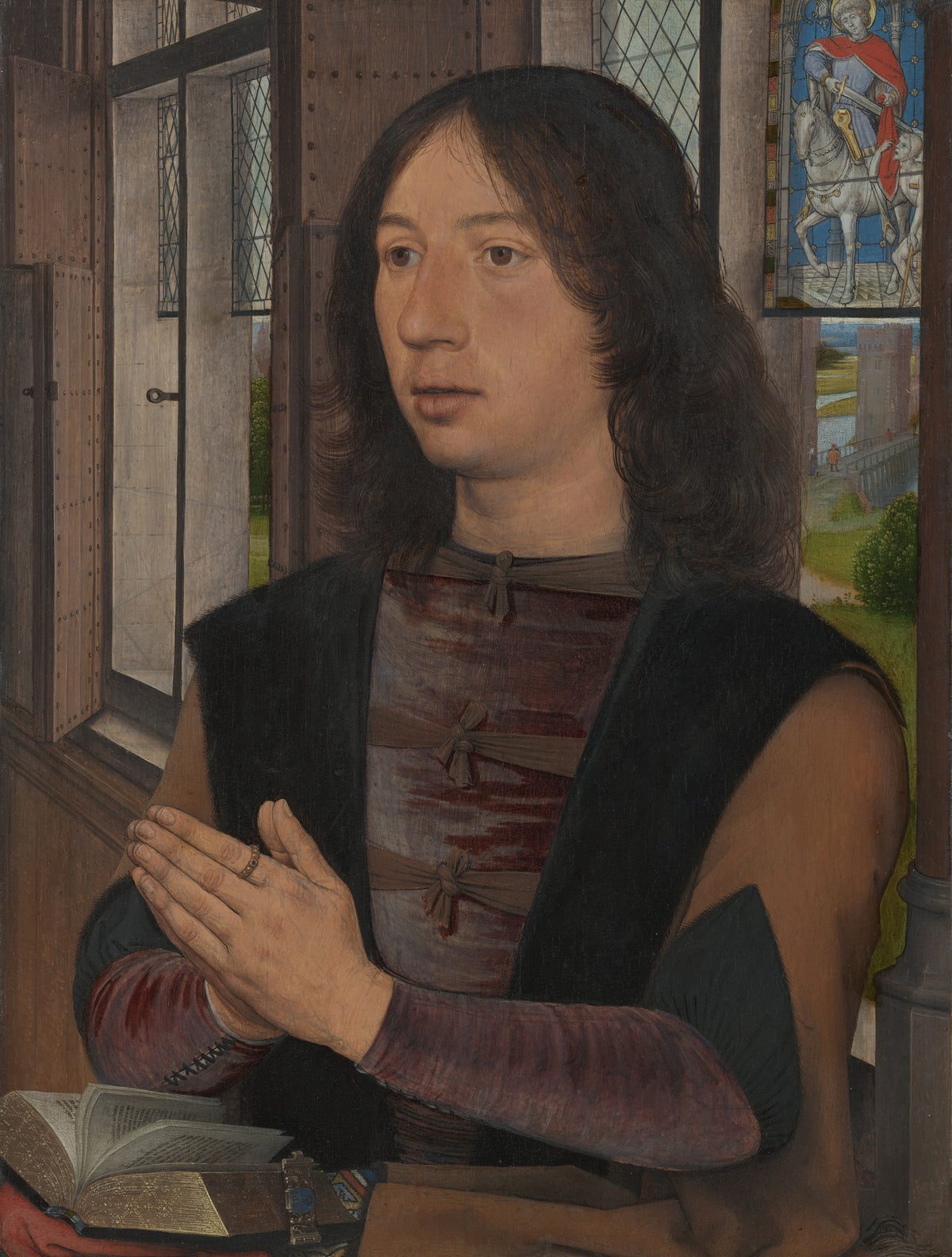 Maarten van Nieuwenhove by Hans Memling — A young man at prayer beside a leaded window