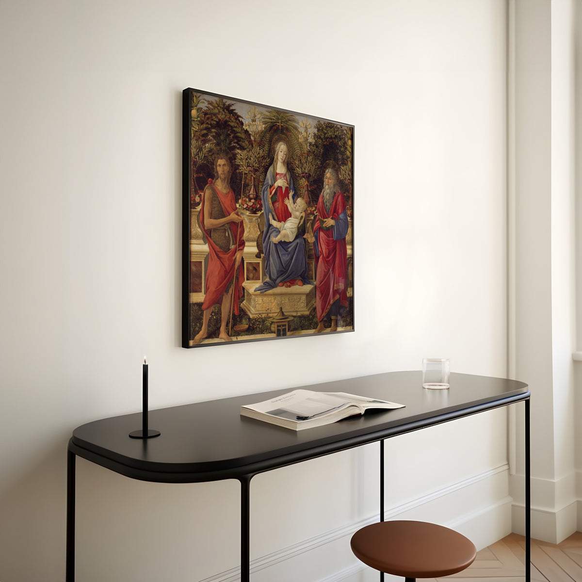 Framed art print of Madonna and Child with both Saints John by Sandro Botticelli, above a slim black console table