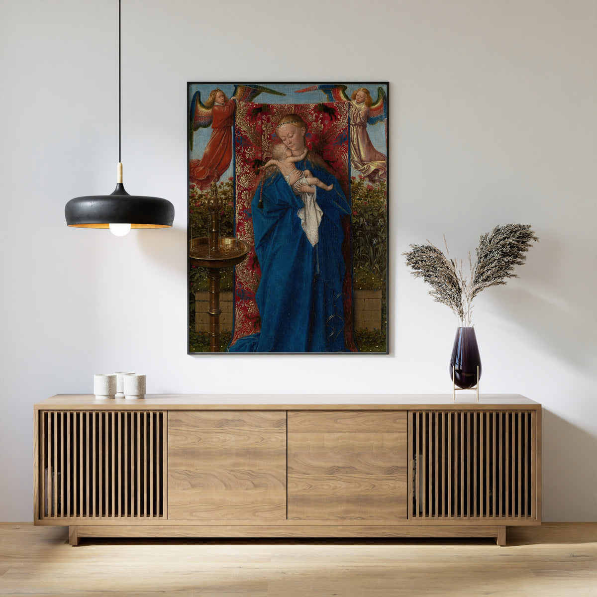 Framed art print of Madonna at the Fountain by Jan van Eyck, above a slatted wood sideboard