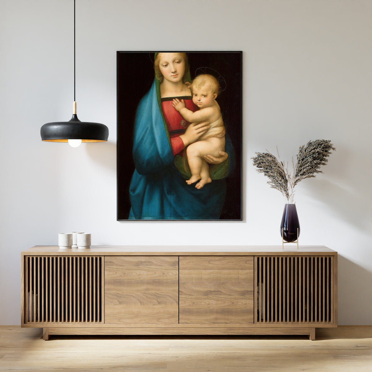 Framed art print of Madonna del Granduca by Raphael, above a slatted wood sideboard