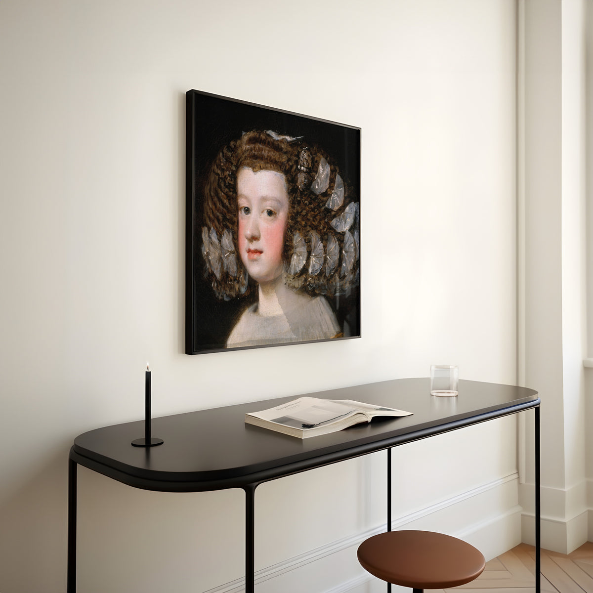 Framed art print of María Teresa, Infanta of Spain by Diego Velázquez, above a slim black console table