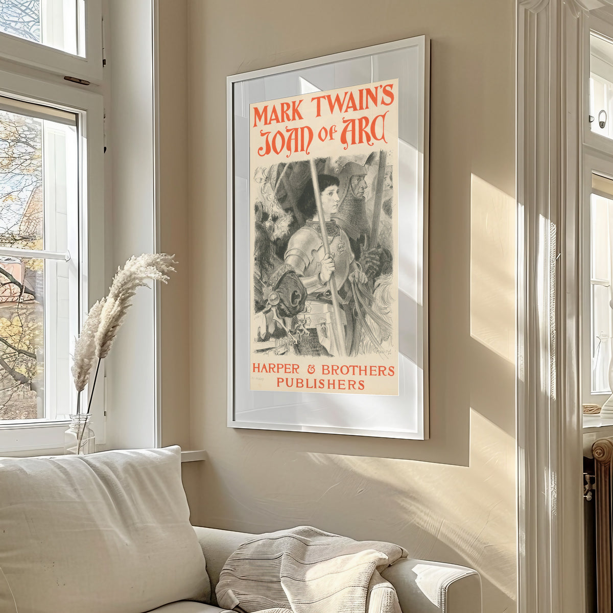 Framed art print of Mark Twain's Joan of Arc by Eugène Grasset, in a sunlit living room above a sofa