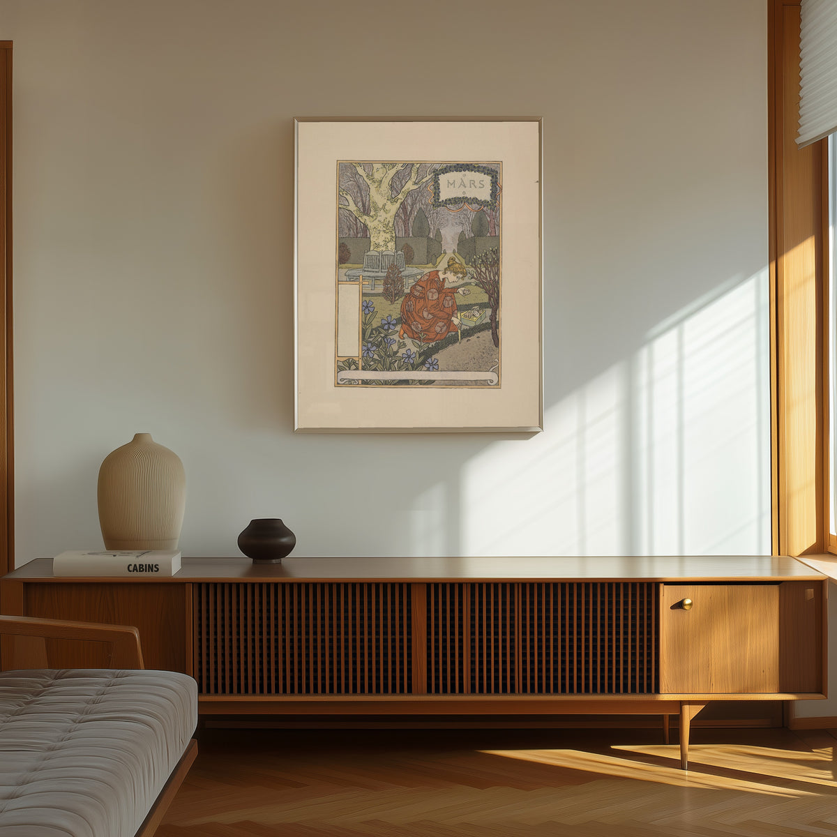 Framed art print of Mars by Eugène Grasset, in a thin light frame on a sunlit wall above a wooden sideboard