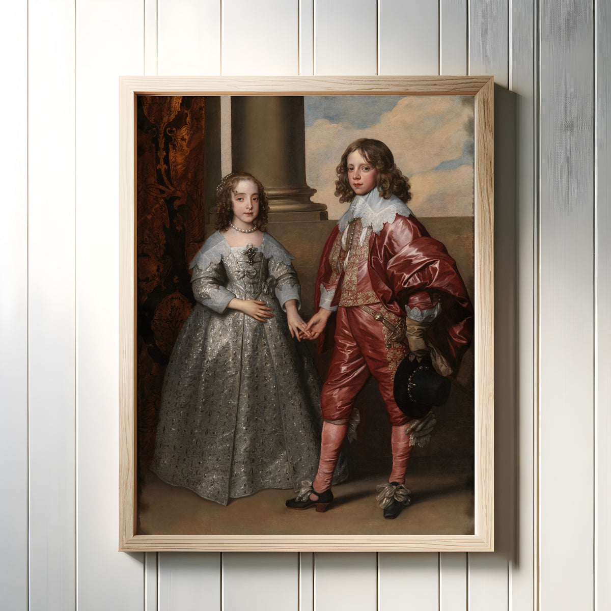 Framed art print of Mary Stuart and William II by Anthony van Dyck, in a light wood frame on a white panelled wall