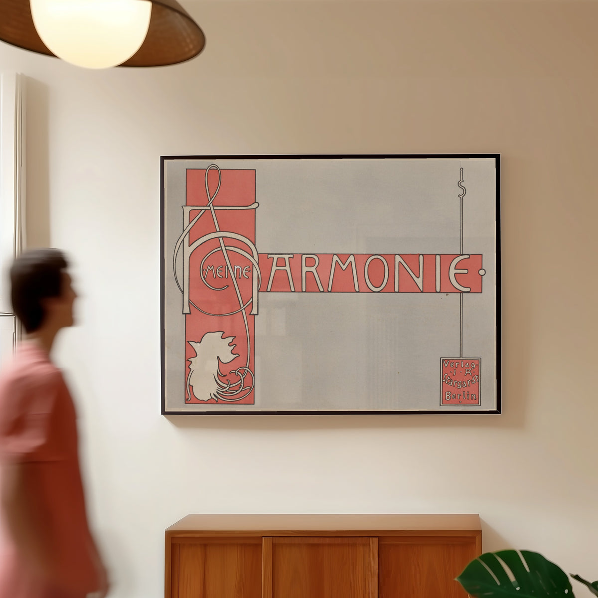 Framed art print of Meine Harmonie: Title Page by Joseph Sattler, in a slim black frame on a warm wall in a sunlit room