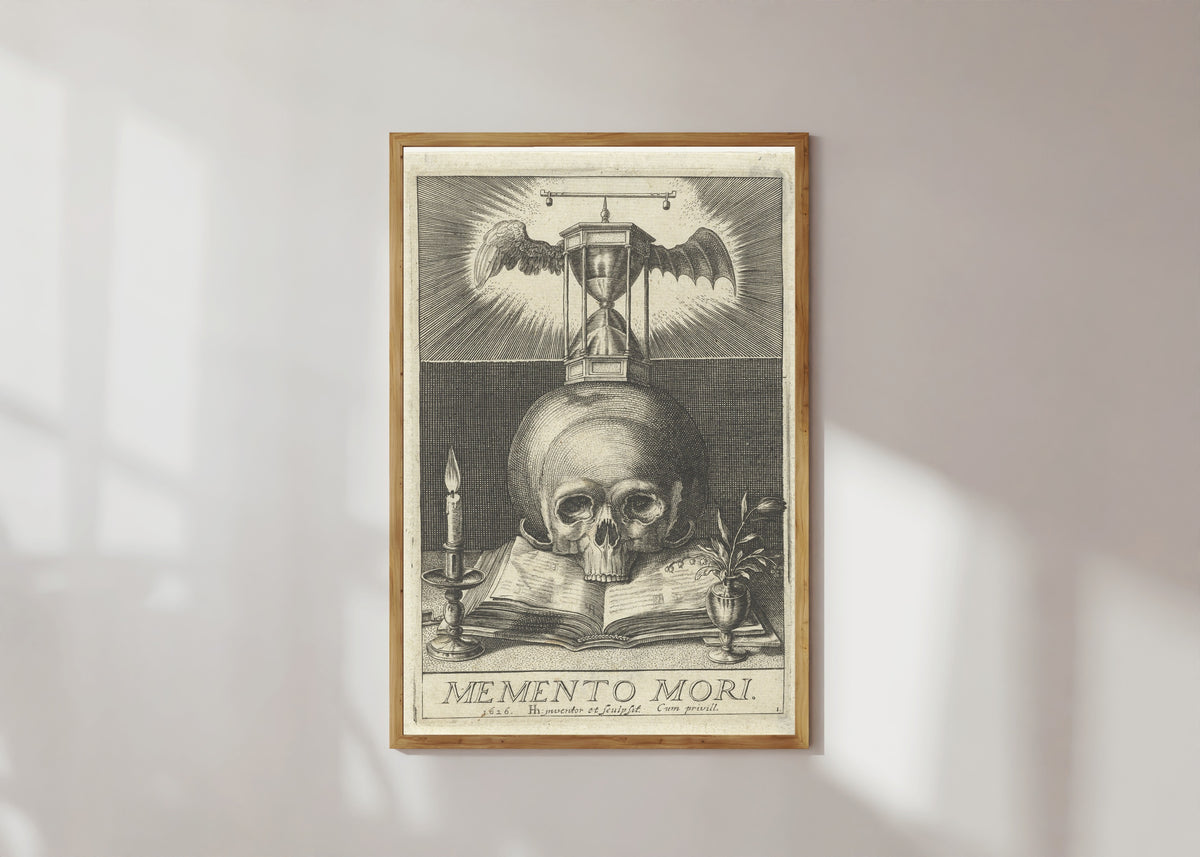 Framed art print of Memento Mori by Hendrick Hondius I, in a light wood frame on a sunlit white wall