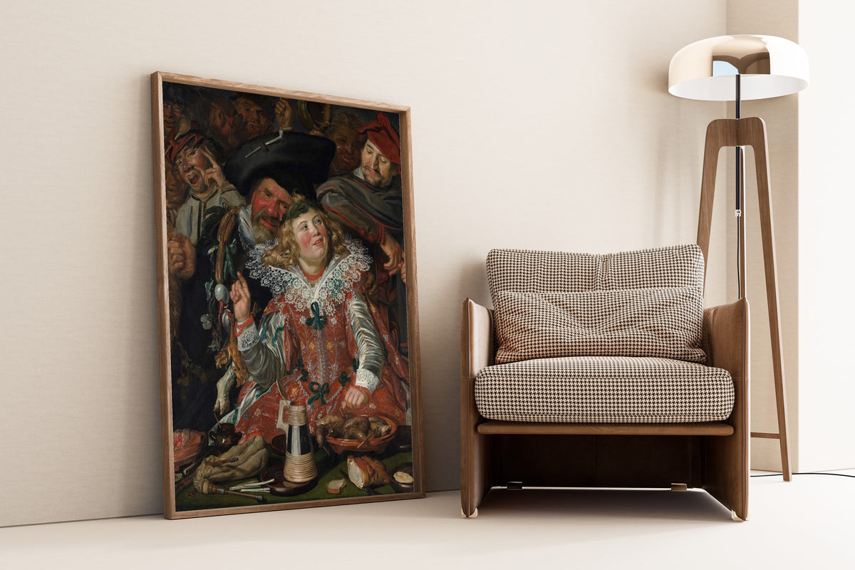 Framed art print of Merrymakers at Shrovetide by Frans Hals, leaning against a wall beside an armchair and a floor lamp