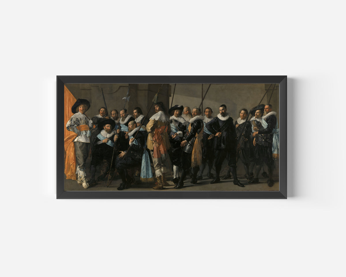 Framed art print of Militia Company of District XI under the Command of Captain Reynier Reael… by Frans Hals, in a wide black frame on a plain white wall