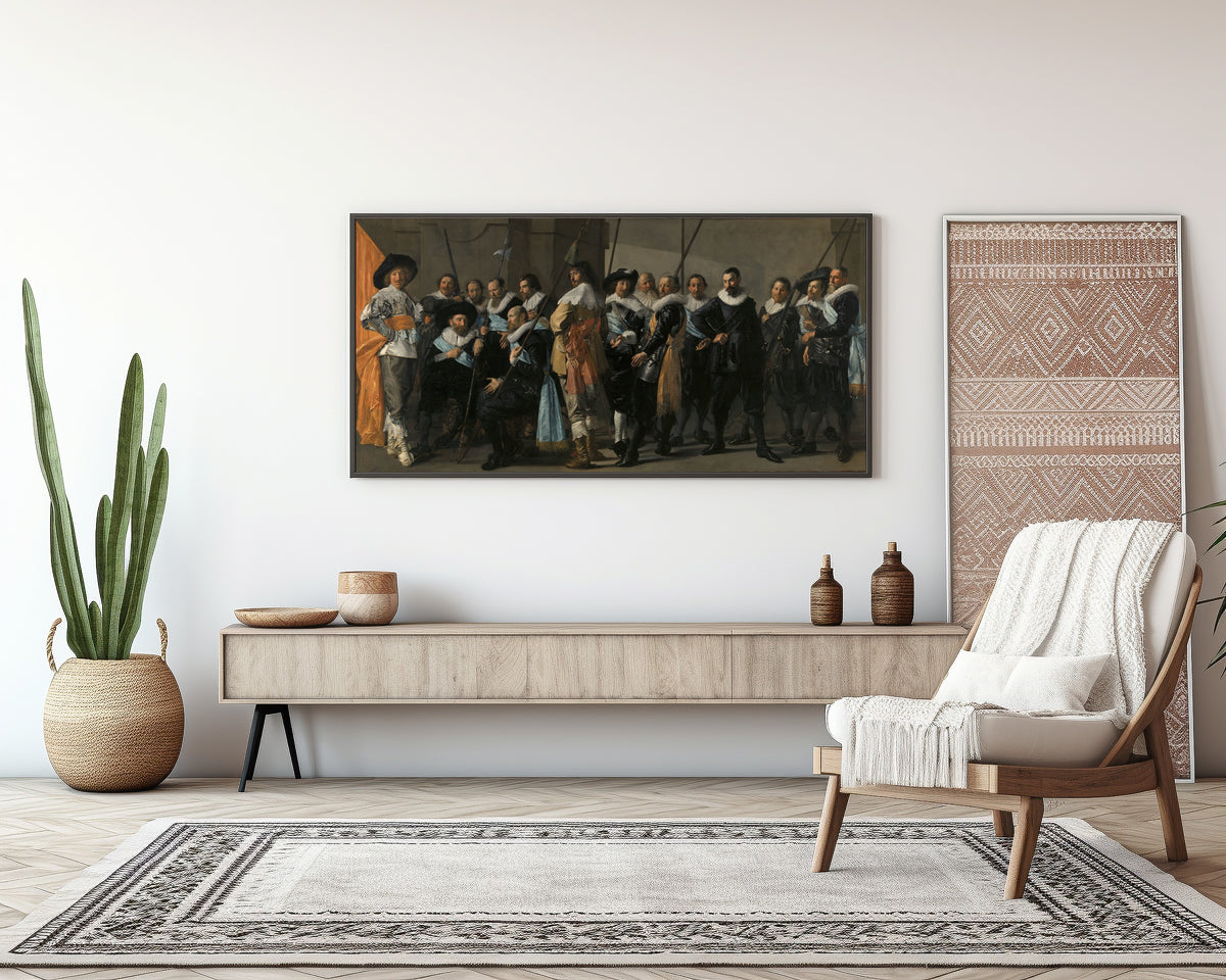 Framed art print of Militia Company of District XI under the Command of Captain Reynier Reael, Known as ‘The… by Frans Hals, above a sideboard in a living room