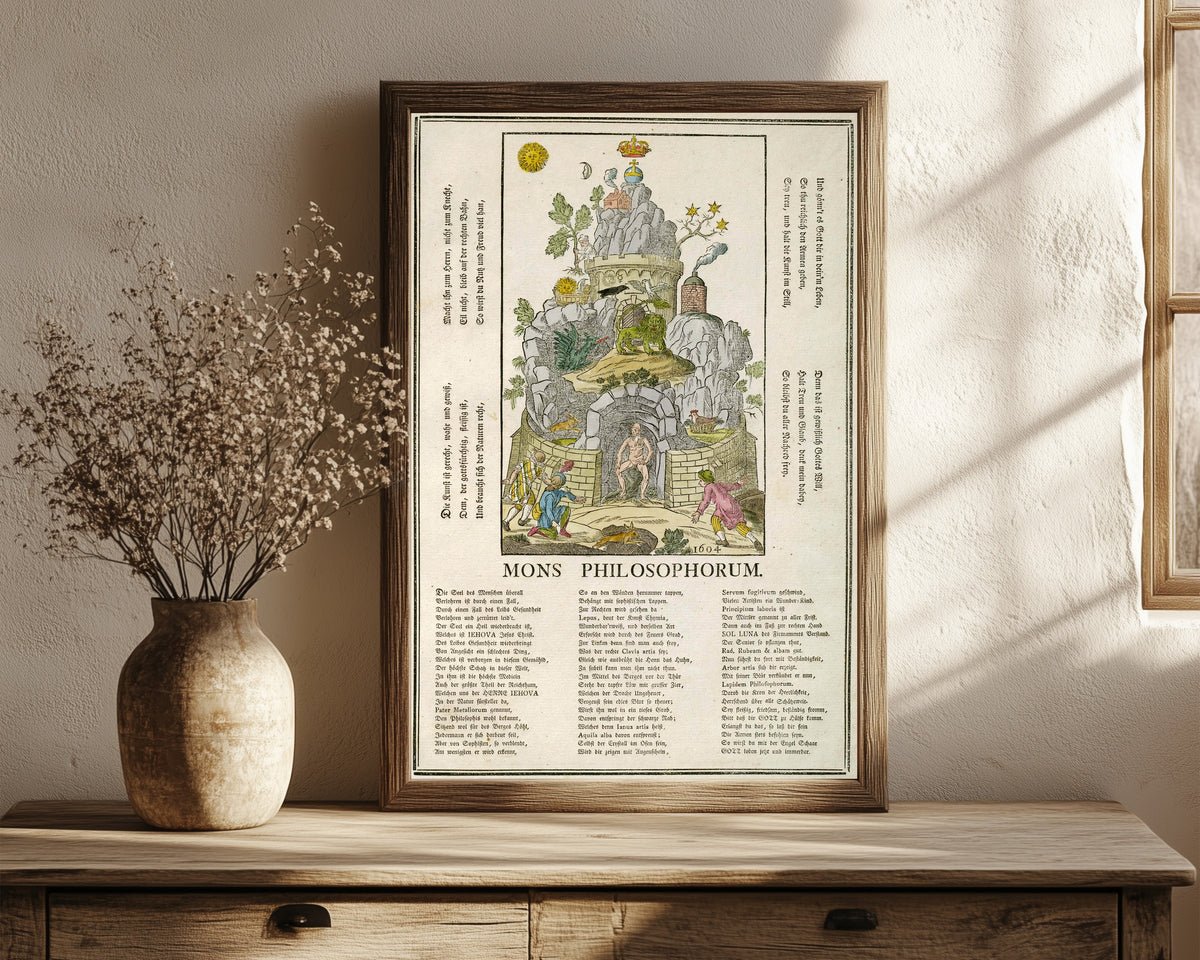 Framed art print of Mons Philosophorum: the Mountain of the… by Unknown artist, in a dark wood frame leaning on a rustic console beside dried flowers