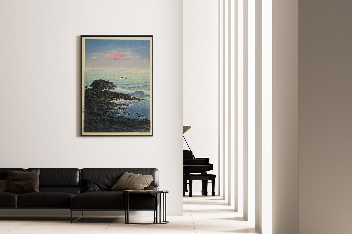 Framed art print of Morning at Cape Inubo by Kawase Hasui, on the wall of a minimal living room