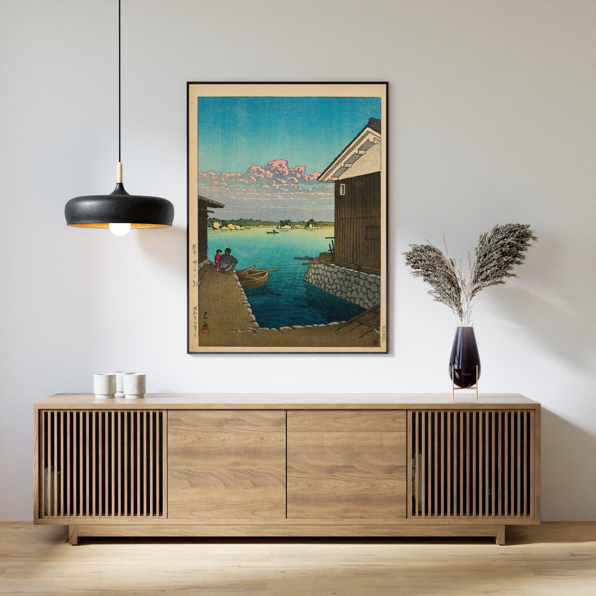 Framed art print of Morning in Yobuko, Hizen by Kawase Hasui, above a slatted wood sideboard